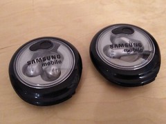 Lot of 2: Stereo In-Ear Earbuds With Windup Case.