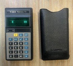 Vintage Canon Palmtronic F-2 scientific calculator w/ Box , Case and paper work