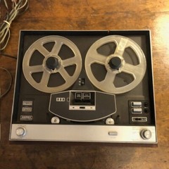 Ampex Model 55 reel-to-reel tape recorder in wooden housing.