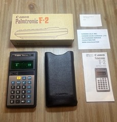 Vintage Canon Palmtronic F-2 scientific calculator w/ Box , Case and paper work